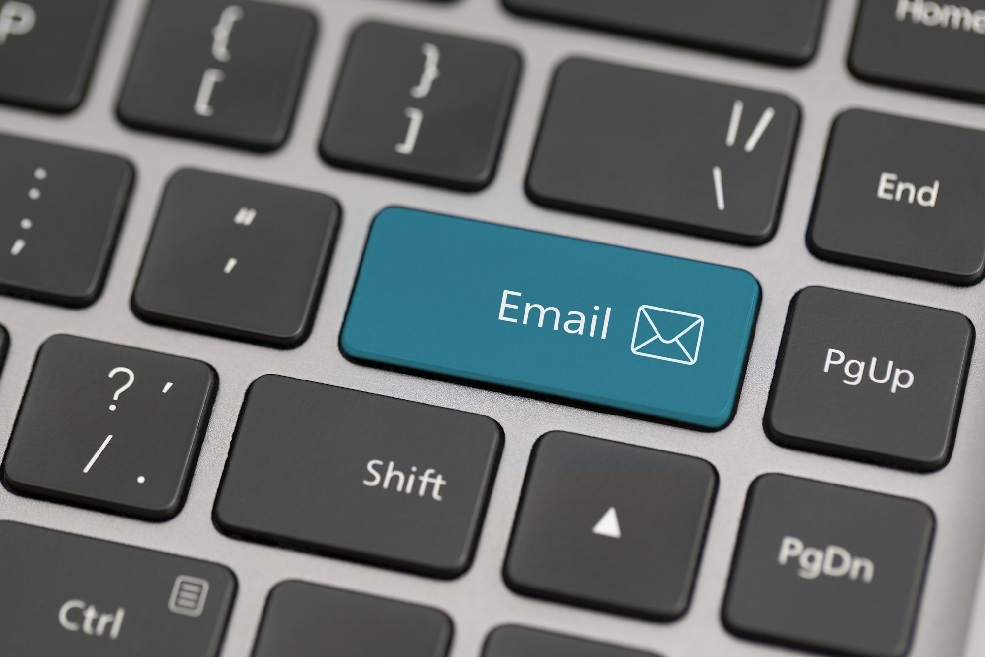 Button with the word email on a keyboard. Communication on internet globally concept.